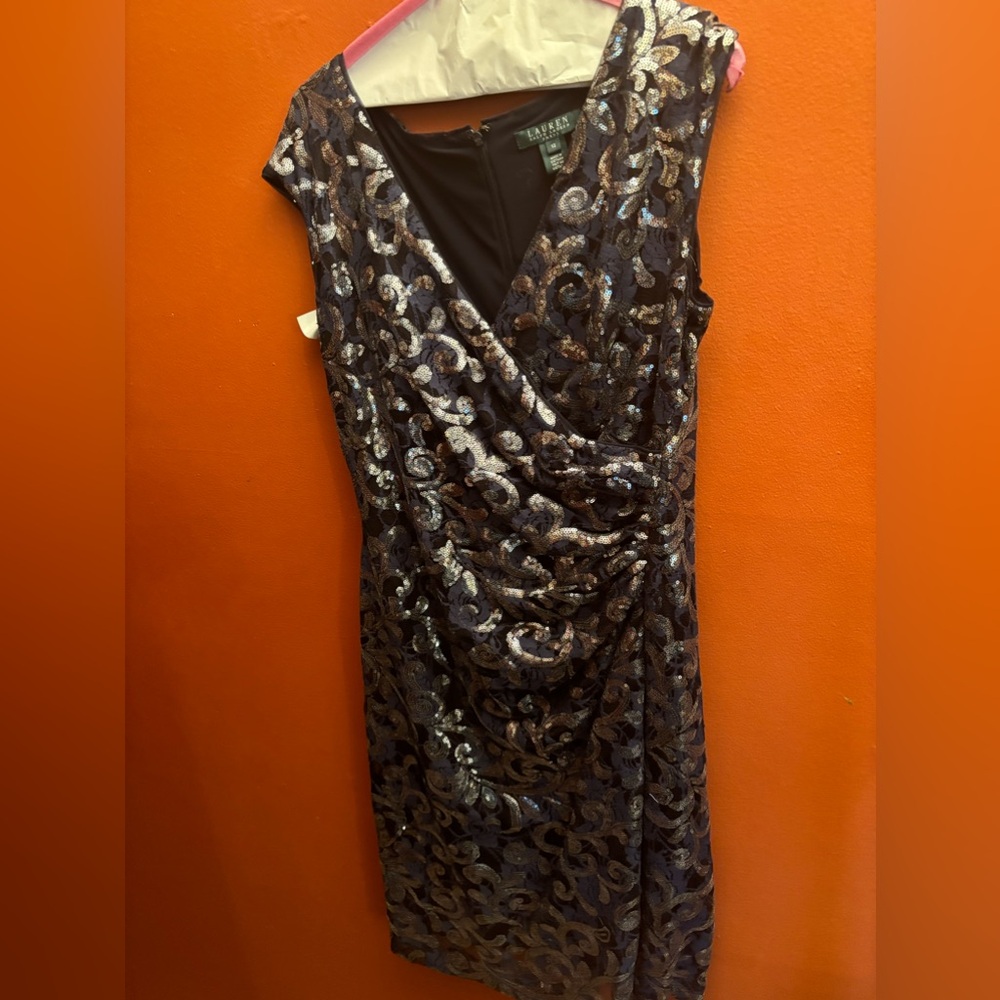 This is an evening dress worn once/ dry. It has lace, floral sequined overlay.